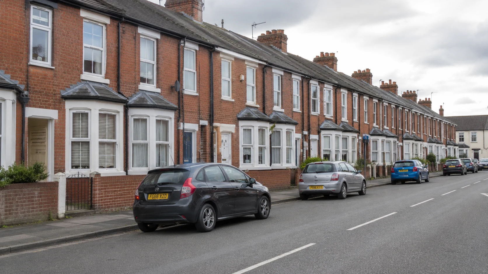 A well-kept row of British terraced houses